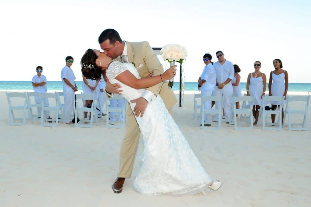 Wedding couple on the sandy beach at Playacar Palace