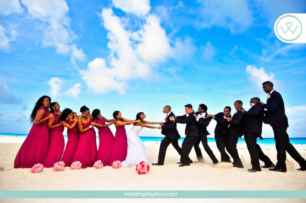 Liz Moore Weddings picture of wedding party on beach beautiful setting 