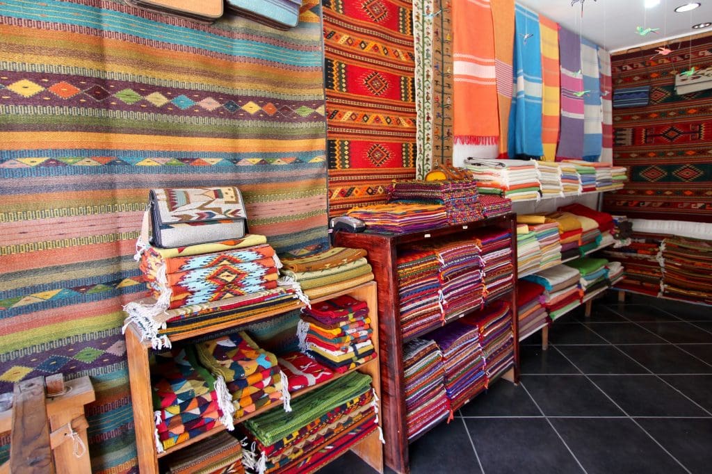 1 Textile stores with table runners and carpets. 