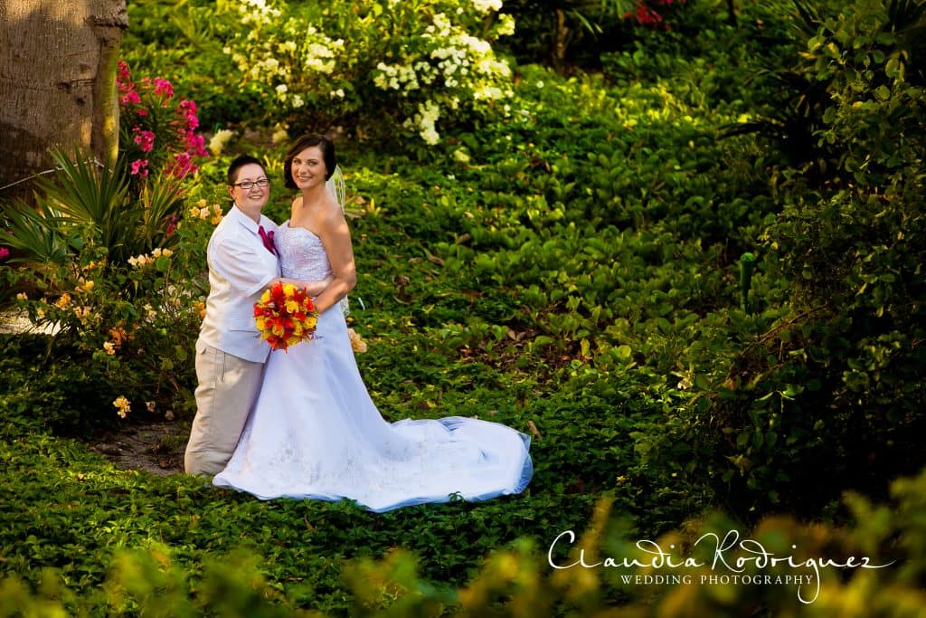  Wedding picture of couple in lush tropical setting 