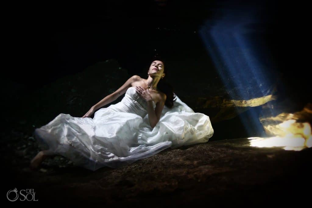  bride in the water on trash the dress. 