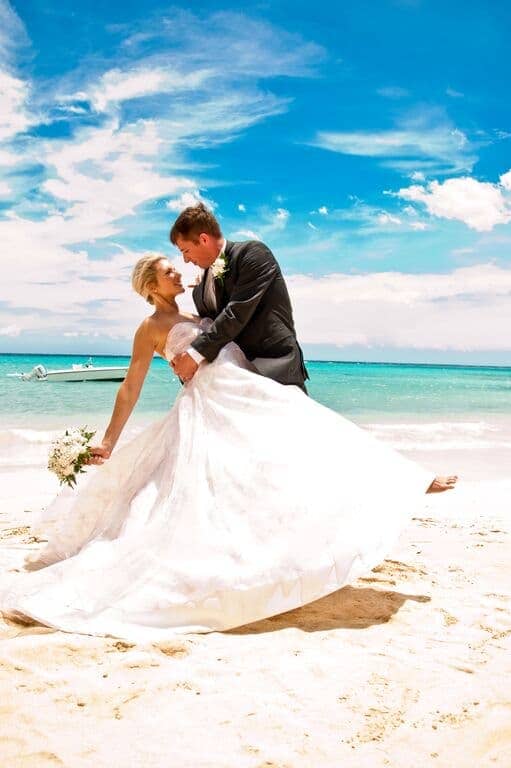  couple on the beach on their wedding day 