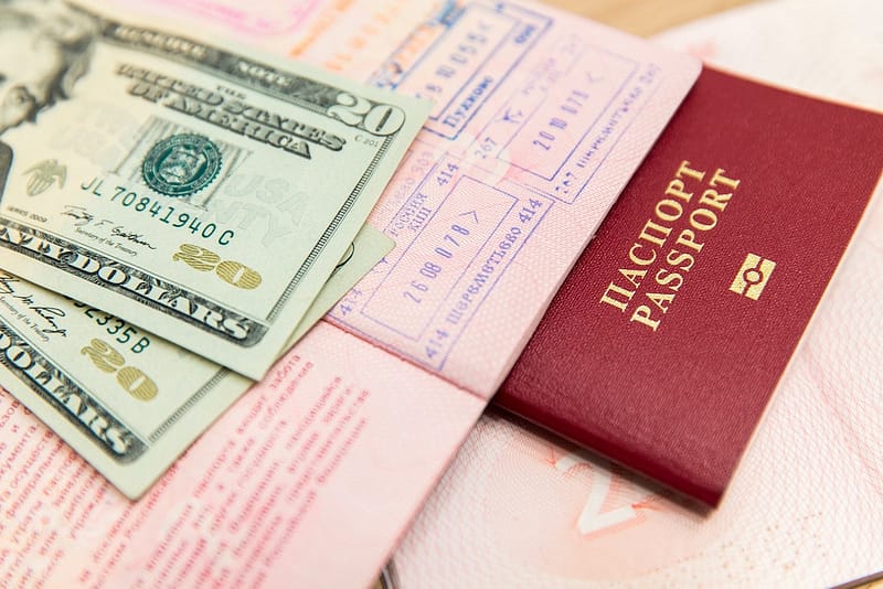 Pictures of passports and money for wedding trip