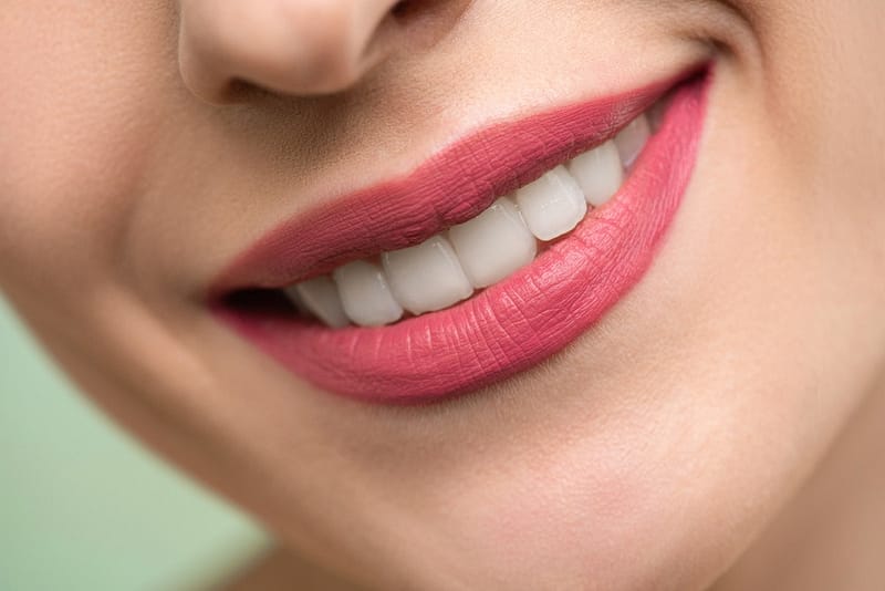 Teeth with pink lipstick