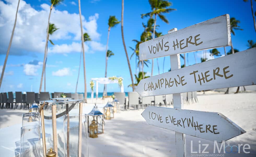 signs to beach destination wedding ceremony on the white sand beach of Punt cana